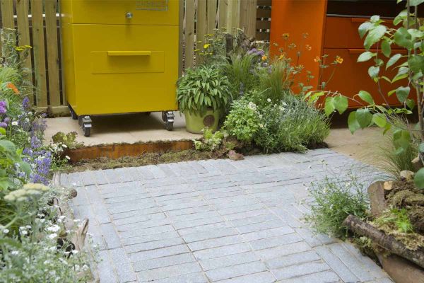 Close-up of Antique Grey Limestone Pavers leading to a raised patio, paired with bullnose steps and planting.***Outerspace Creative Landscaping | Also shows Antique Grey Limestone Steps & Paving