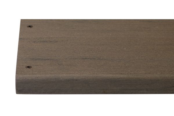 Traditional composite decking board with two Traditional colour match screw fixed to the far left face of the board.***