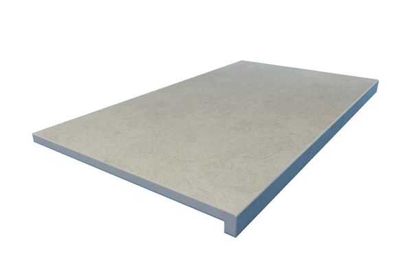 Grey Yorkstone porcelain downstand step with 40mm drop face and soft stone-effect surface. Creates bold architectural lines.***
