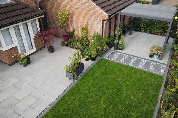 Single Kandla Grey 16mm porcelain paving slab, viewed from above, showing texture and markings including imitation riven surface.  ***