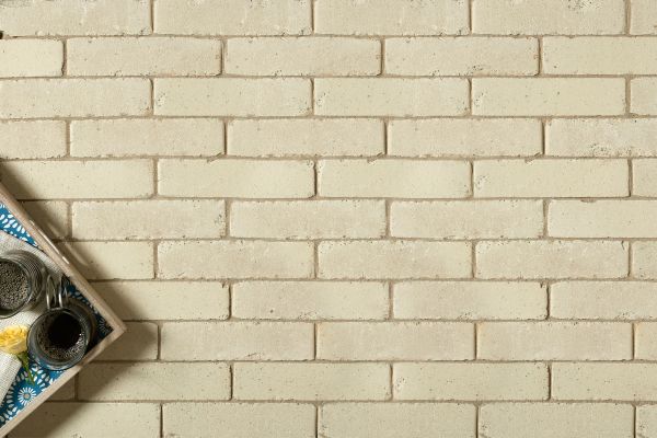 Close-up shot of Oslo Clay Pavers, including corner of tray with drinks, that shows texture and colour of this beautiful brick paver.***