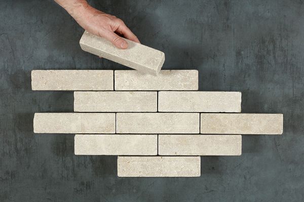 Antique Egyptian Beige Limestone Pavers arranged in a square-laying pattern, emphasizing the textured surface and natural weathered appearance.***Image for illustrative purposes only, not installation guidance

