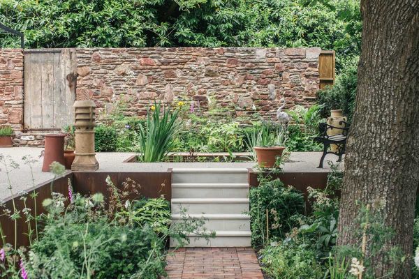 Garden steps ideas from Artisan Landscapes, with 5 Beige Smooth Sandstone step treads from path to walled terrace with pond.***Image also displays Dorset Antique Pavers | Artisan Landscapes, www.artisanbristol.com | Photographed by Finn P Photography