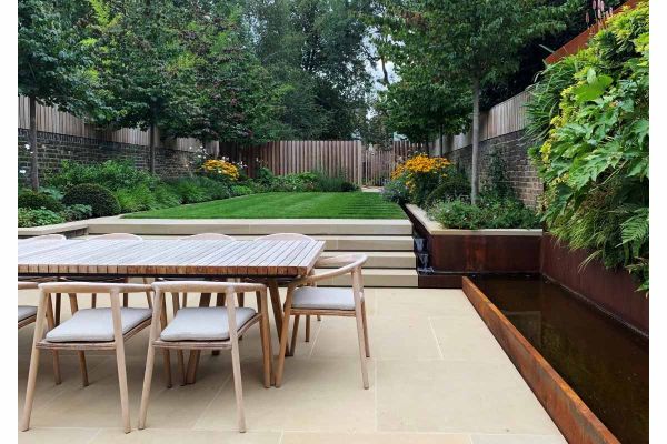 Oblong garden with beds down each side and rill between bed and lawn .4 steps descend to patio of York stone flags.***Designed by Tom Massey, www.tommassey.co.uk | Built by Landform Consultants, www.landformconsultants.co.uk

