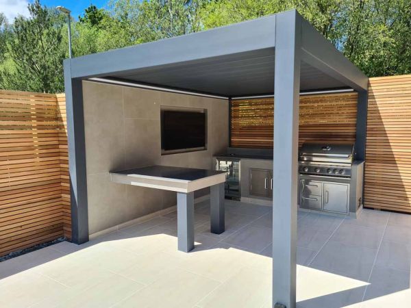 JJH Landscapes,  www.jjhlandscapes.co.uk (Image also displaying a Pinela Deluxe Louvered Roof Pergola & Faro Porcelain Paving)