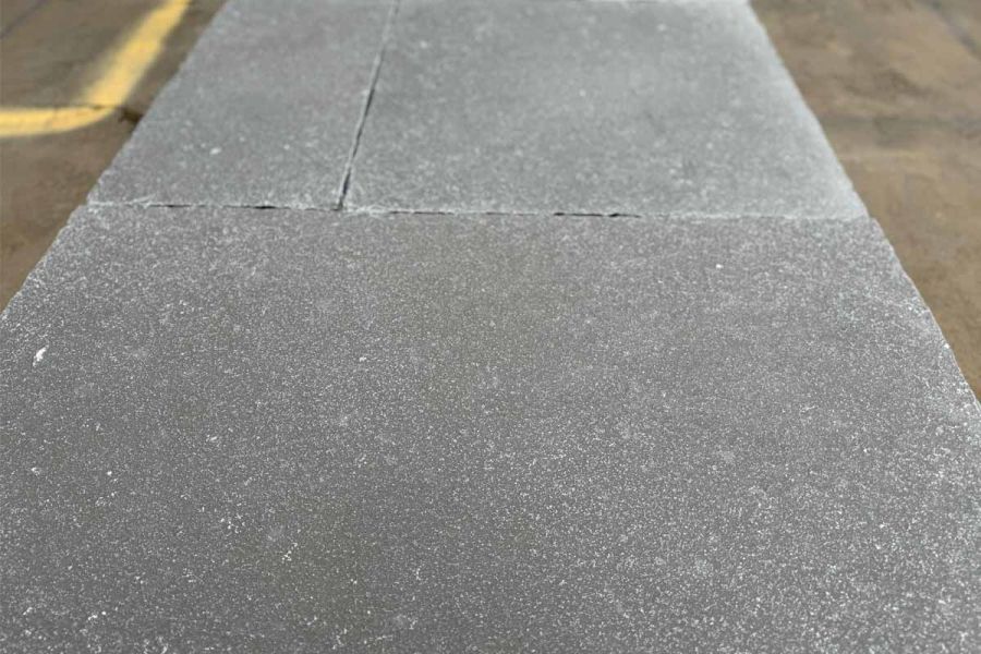 Detailed close-up of Antique Grey Limestone paving, highlighting its organic texture and artisanal finish.
