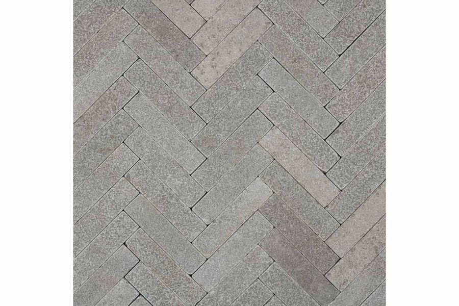 View directly down onto Antique Grey limestone patio bricks laid in herringbone pattern. Free UK next-day delivery available.