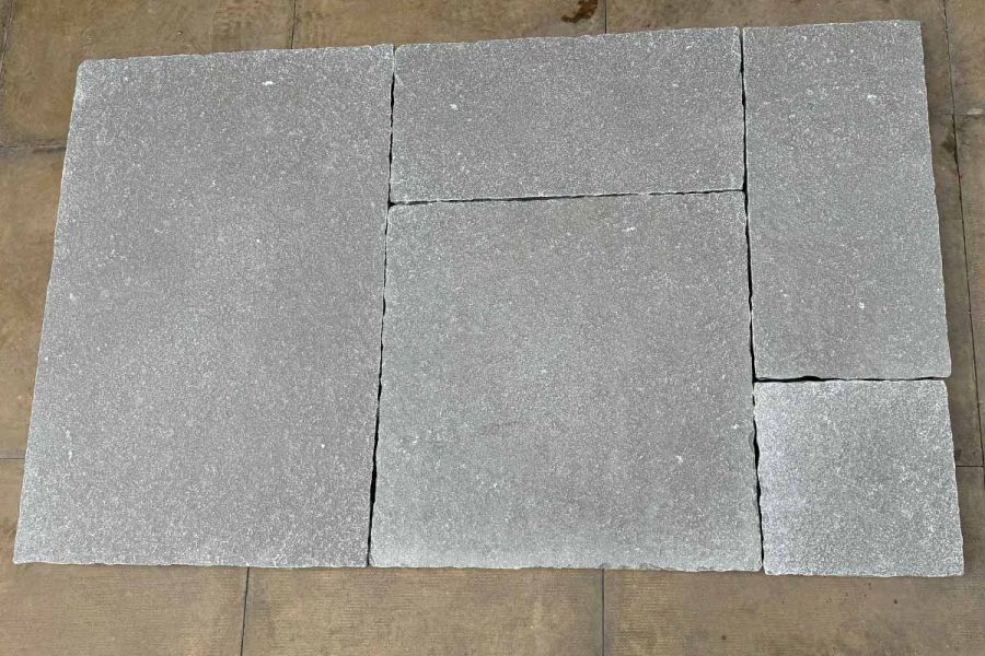 Detailed image revealing the authentic charm and hand-hewn edges of Antique Grey Limestone paving.