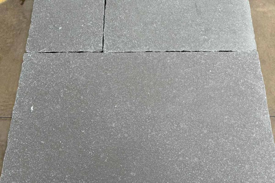 Up-close view capturing the natural nuances and hand-cut precision of Antique Grey Limestone paving.