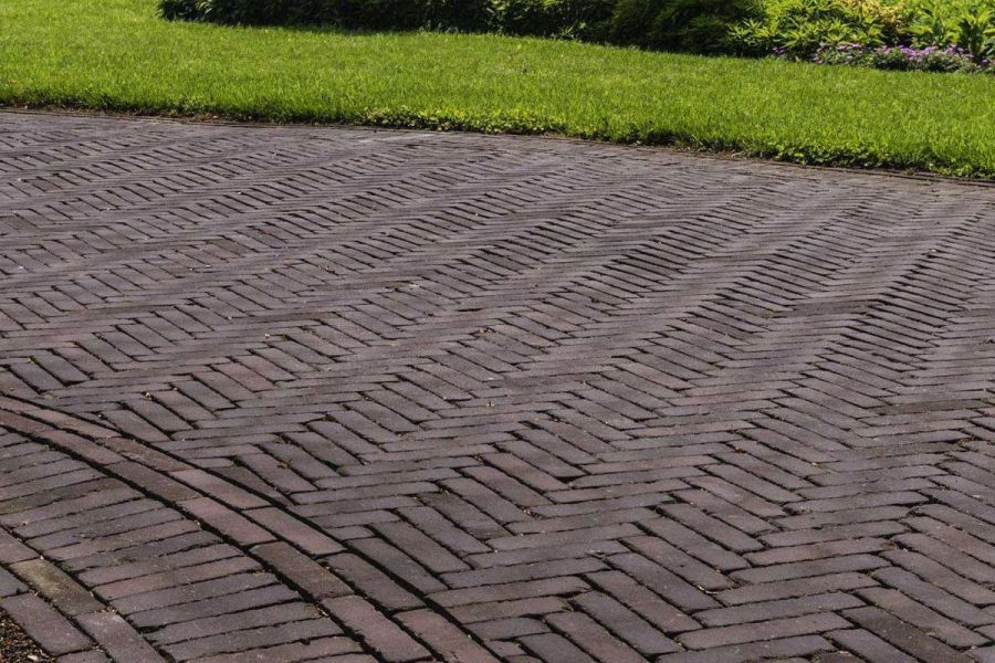 Lawn edges large area of Bolzano Dutch clay pavers laid in different patterns incorporating curves.