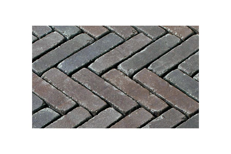 Section of Bolzano brick pavers laid herringbone pattern with wide, unsanded joints, showing tumbled edges and tonal variation.