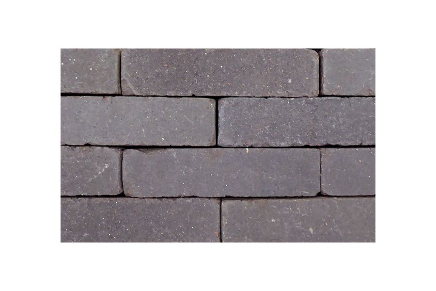 Close up view of the charcoal grey clay paving where you can see these brick pavers flecks of light within the grey.