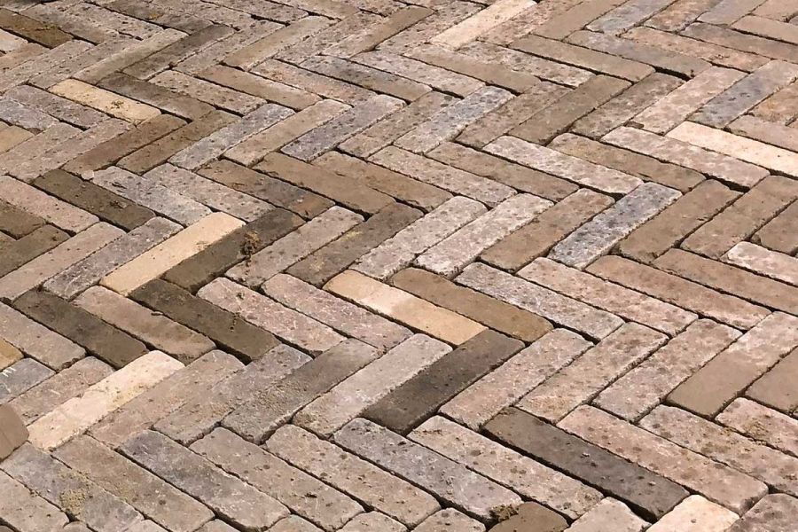 Derby brick pavers laid herringbone fashion, showing variety of dark and light brown tones. Free UK delivery available