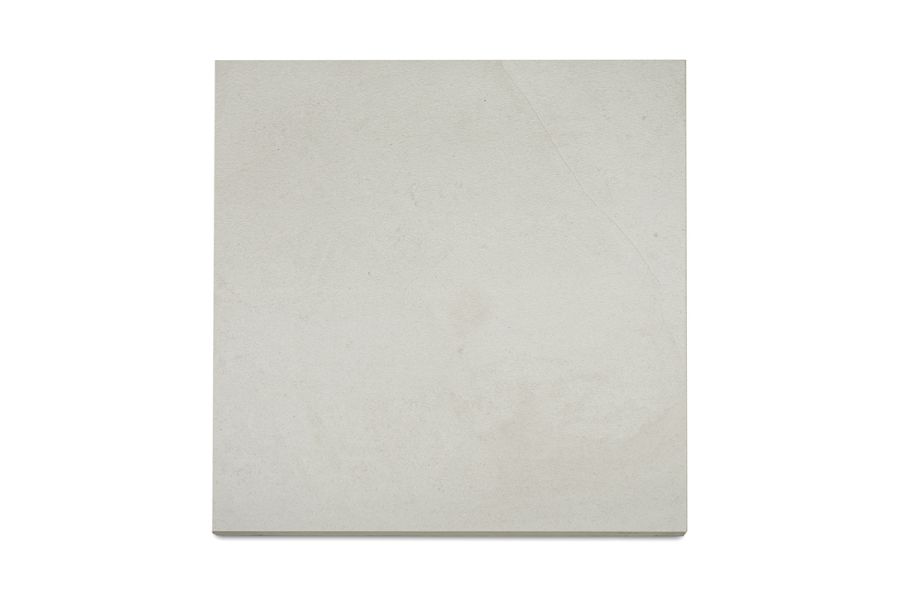 Light coloured Comblanchien Porcelain paving slab, available in stock from London Stone with a sandblasted texture.