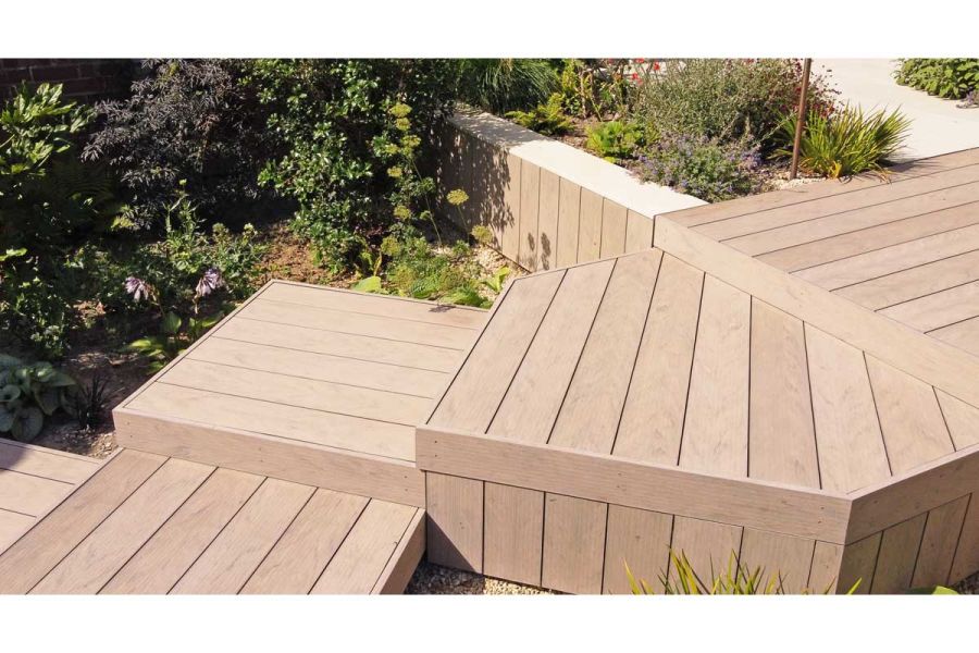 Zigzag of square steps of Traditional DesignBoard composite decking, with matching facing descends slope. Design by Doug Holloway.