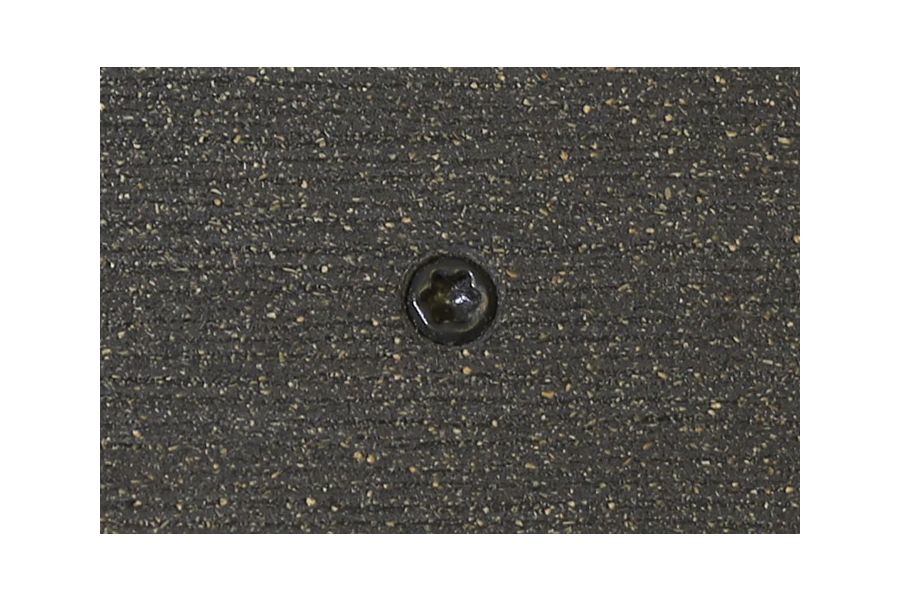 Charcoal composite decking board with Charcoal colour match screw fixed to the middle of the board.