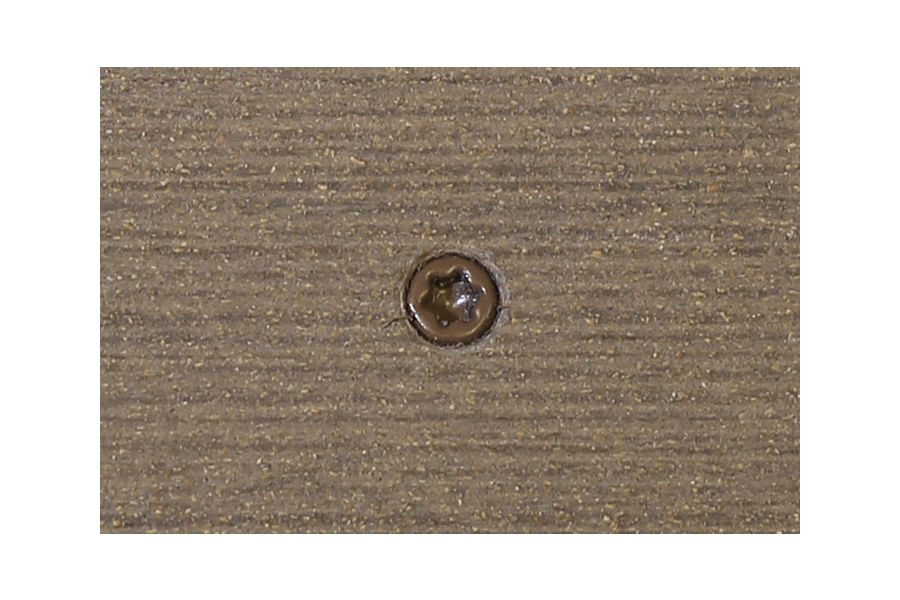 Traditional composite decking board with Traditional colour match screw fixed to the middle of the board.