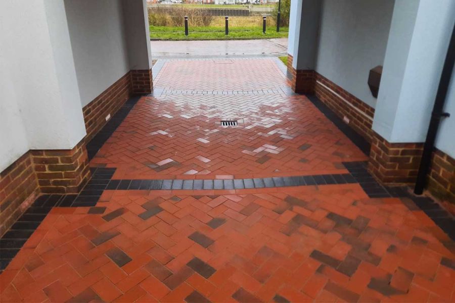Red and blue Delta Light Multi Driveway Pavers laid by P Halliday Ltd with Delta Blue block paving in undercover parking area.