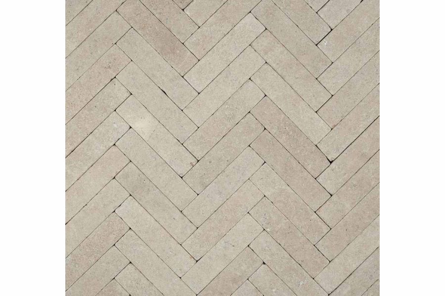 View directly down onto Egyptian Beige limestone stone pavers laid in herringbone pattern. Free UK next-day delivery available.