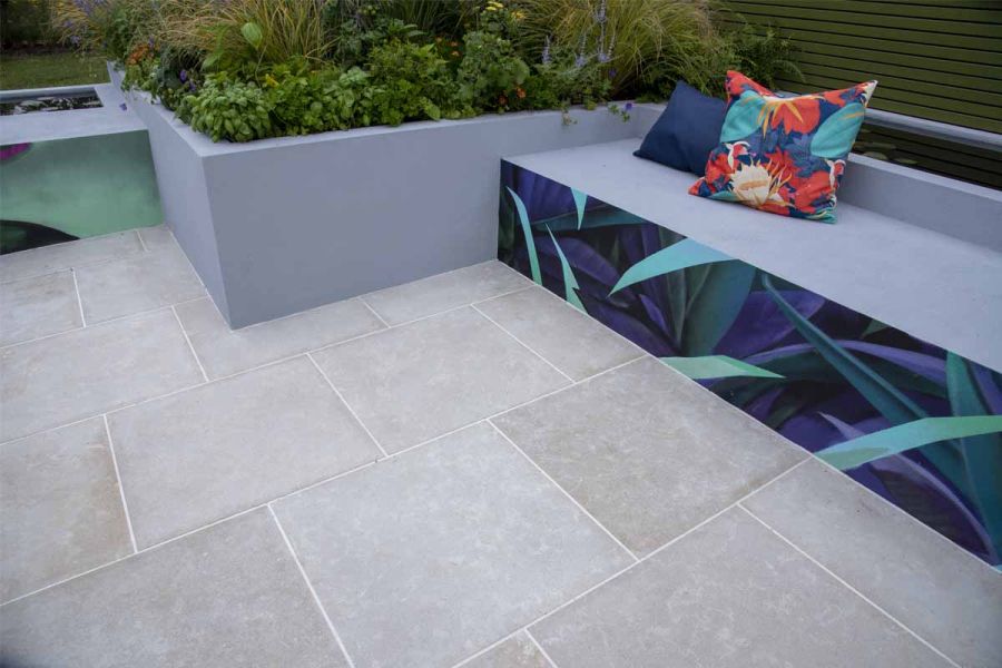 Egyptian Beige smooth limestone, laid running bond, with grey-walled raised beds. Design by Emma Tipping, RHS Tatton Park 2022.