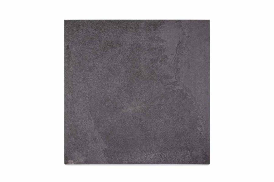Single Florence dark porcelain paving slab seen from above, showing markings and colour variation. Available with free UK delivery.