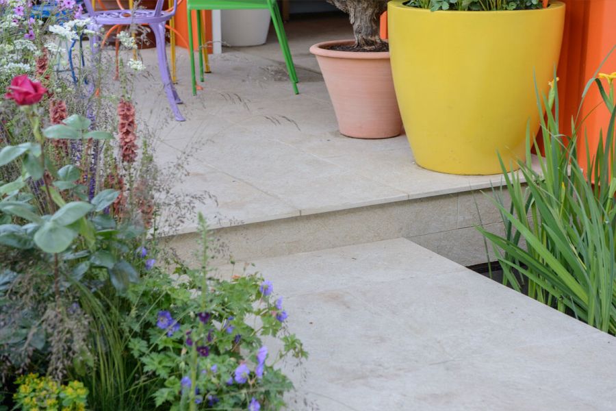 Step up from path to seating area, all in Golden Stone Porcelain, with matching riser at RHS Chelsea 2016, by Ann-Marie Powell.