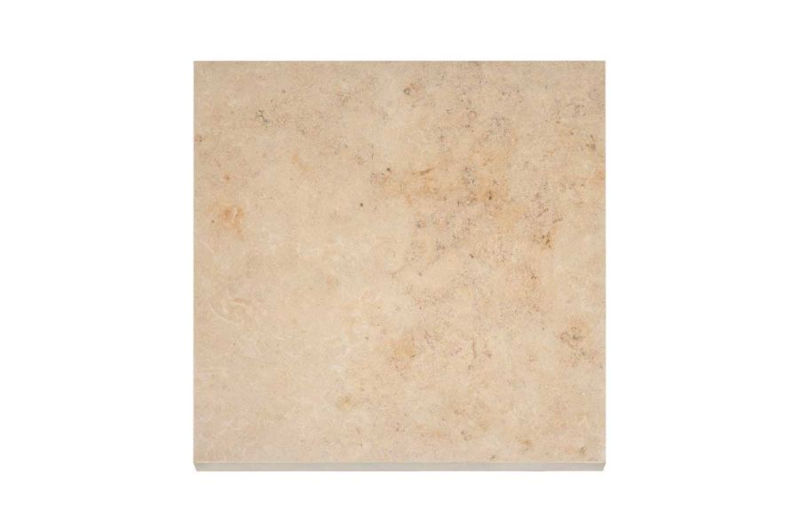 Looking down on a 600x600 Jura Beige porcelain paving slab showing the beige base colour with occasional darker veins.