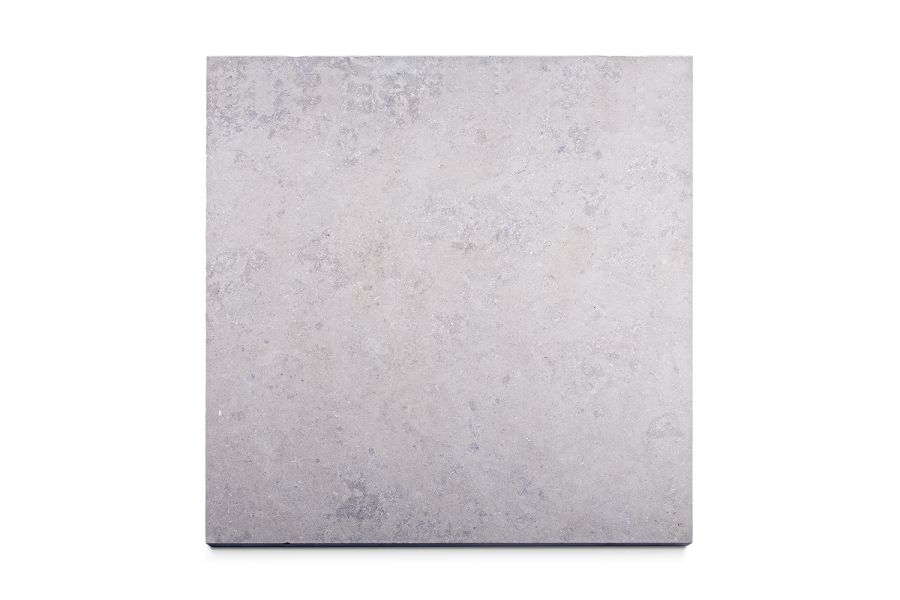 Single pale-coloured Jura Grey sawn limestone slab seen from above, showing texture and markings. Free UK delivery available.