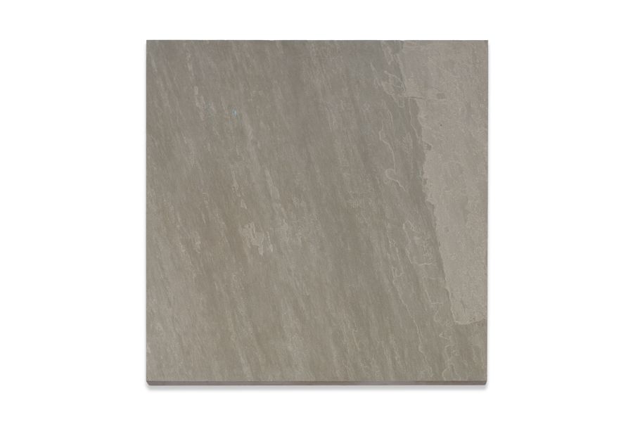 Single Kandla Grey porcelain paving slab, viewed from above, showing texture and markings including imitation riven surface.