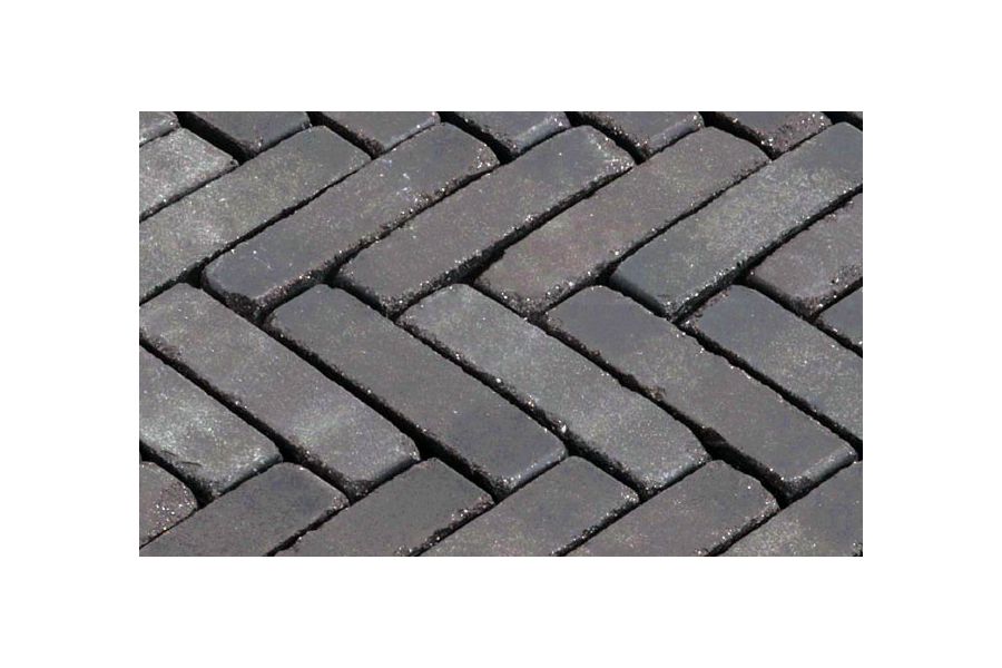 Close-up of Lucca brick paving laid herringbone, showing dark tones when wet. Free next-day UK delivery available.