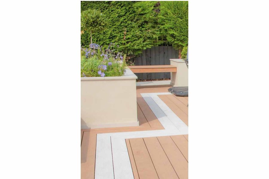 Coffee-coloured Designboard Mocha laid in 2 directions to form zigzag design with Polar WPC decking, outlining edge of patio.