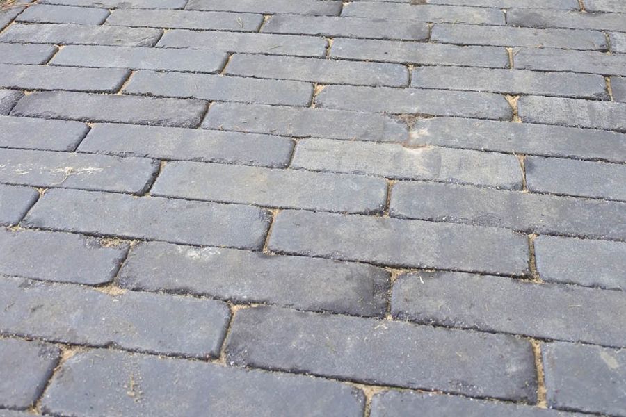 Close-up of grey Lucca clay paving, laid stretcher bond fashion, showing even colour. Free next-day UK delivery available.