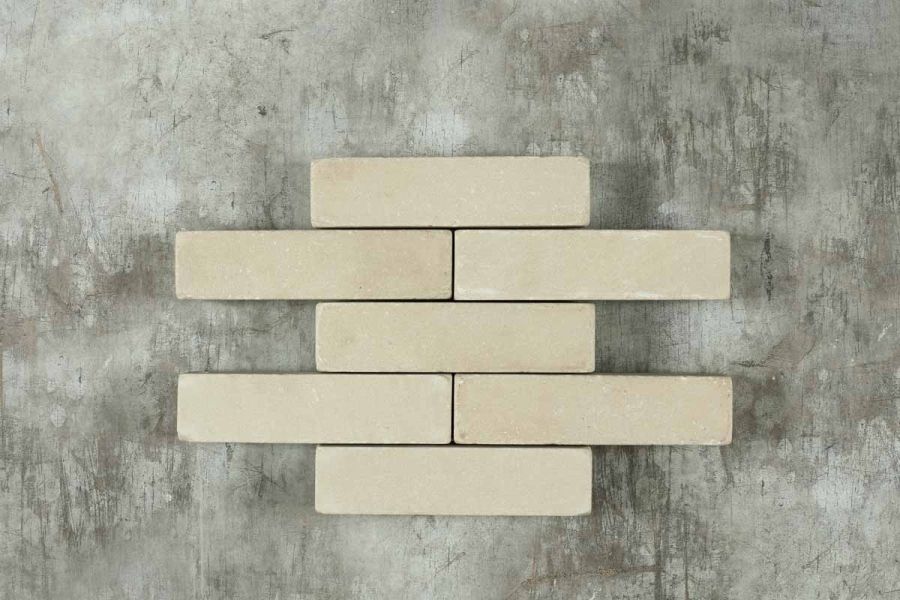 7 Beige sandstone patio bricks arranged in alternating rows of 1 and 2. Part of Stone Paver range. Free UK delivery available.