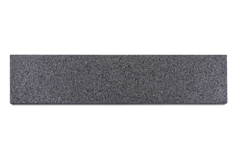 Single Black Granite plank paving slab, seen from above on white background, showing grey and black flecked colouring and shape.