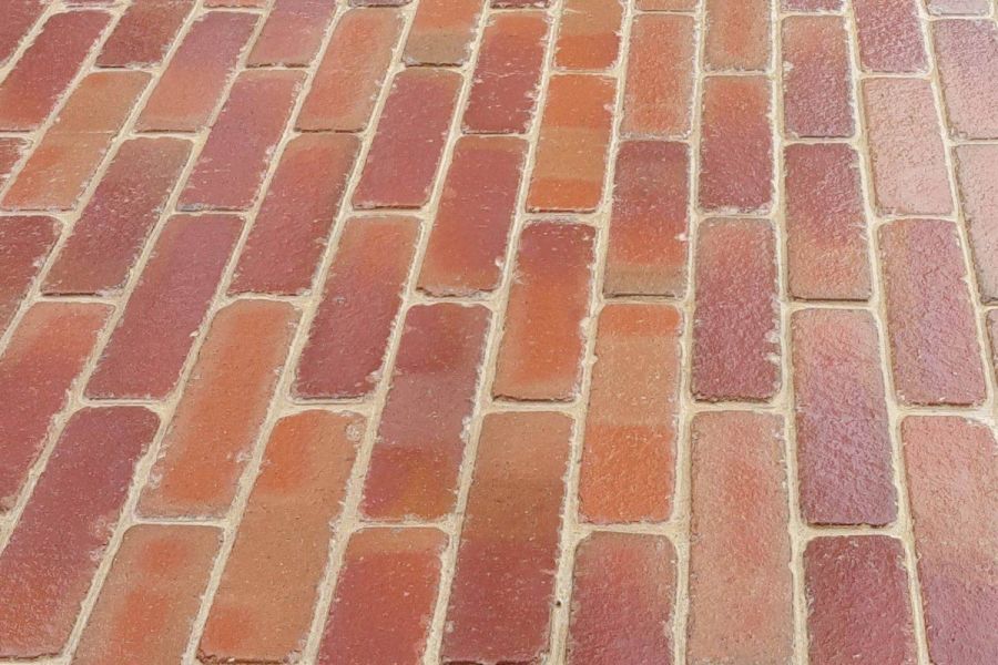 Close view of Seville clay pavers laid running bond with joints of cream mortar. Free UK delivery available.