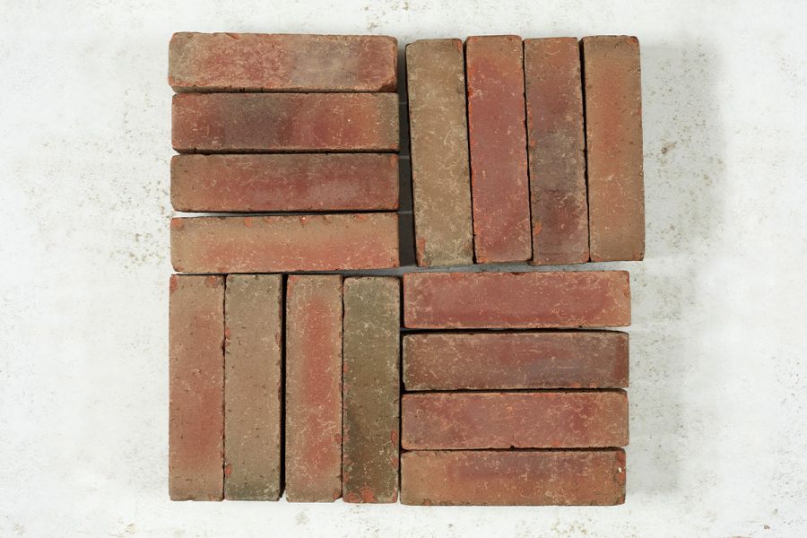 16 Seville clay pavers from Alpha collection laid in 4 blocks of 4 at right angles to each other within a square.