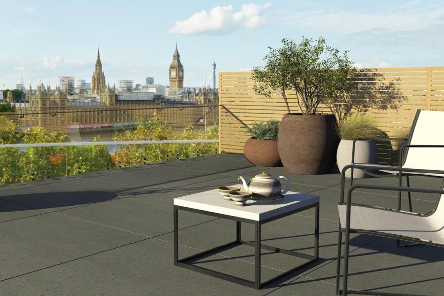 London rooftop garden paved with Sidewalk porcelain looking across the river Thames towards the houses of parliament.