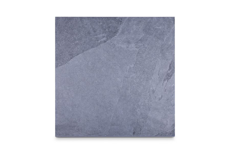 Single square tile of blue-grey Slab Coke Porcelain Paving, showing feigning and surface texture. comes with 10-year guarantee.