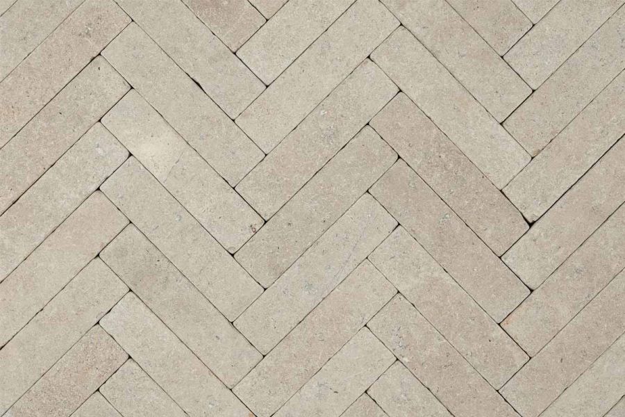 View directly down onto Egyptian Beige limestone pavers laid in herringbone pattern without joints. Free UK delivery available.