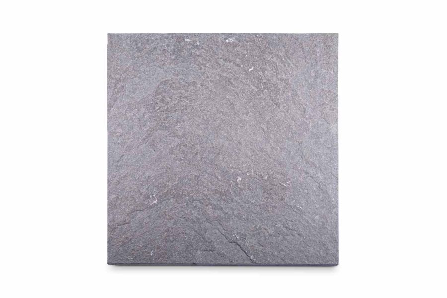 Single Graphite Grey limestone slab seen from above, showing riven surface texture and markings. Free UK delivery available.