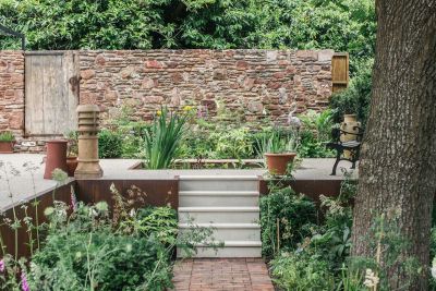 Garden steps ideas from Artisan Landscapes, with 5 Beige Smooth Sandstone step treads from path to walled terrace with pond.***Image also displays Dorset Antique Pavers | Artisan Landscapes, www.artisanbristol.com | Photographed by Finn P Photography