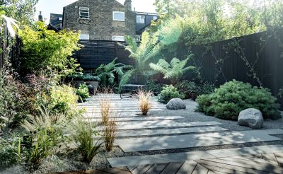 Staggered Beige Smooth sandstone plank paving with wide gravel joints laid between beds planted with grasses, low shrubs and ferns.***GRDN Landscape + Garden Design, www.grdndesign.co.uk (Image Copyright Da Feng)