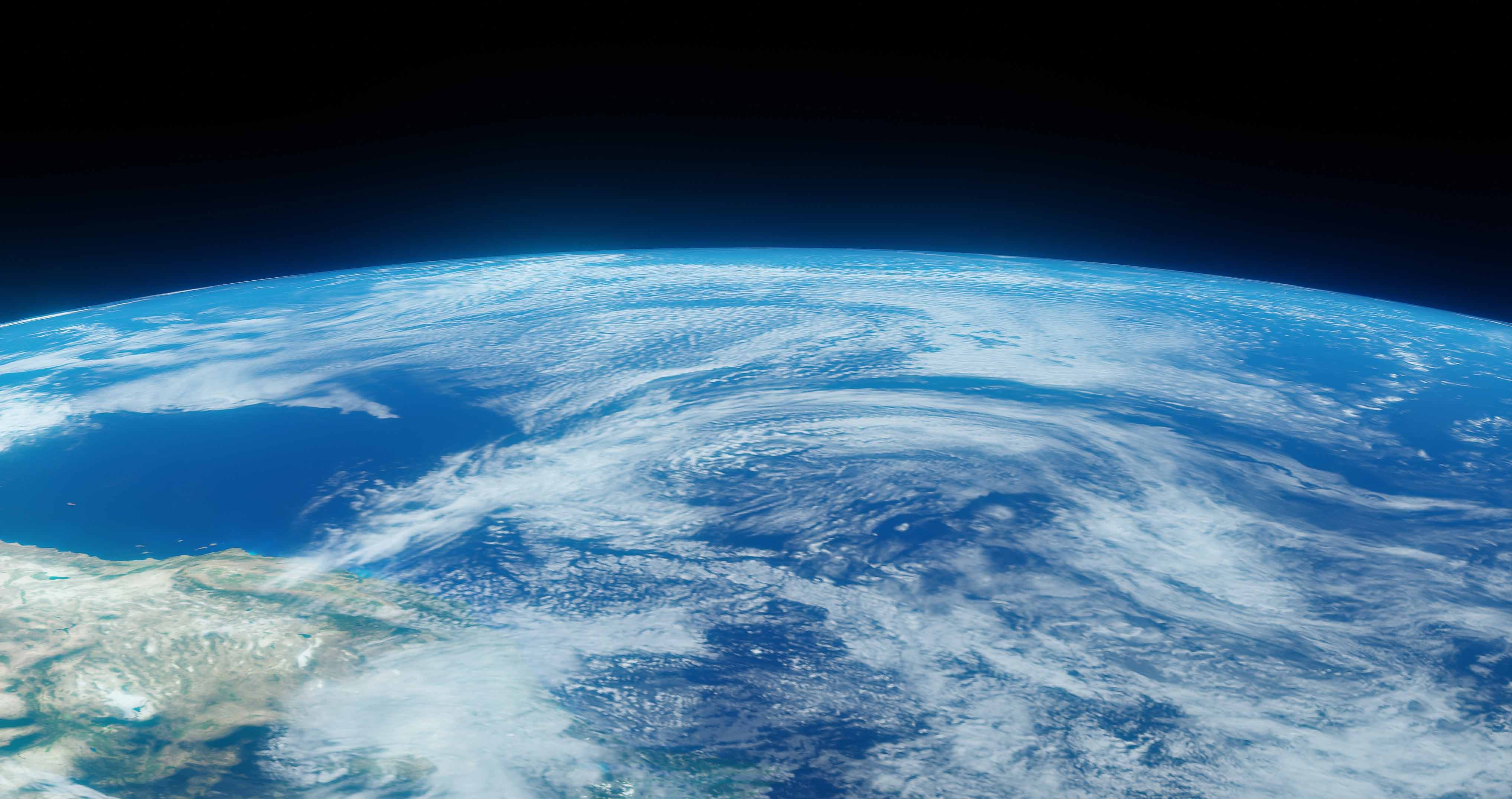 Slow moving view of earth with swirls of blue and white clouds.