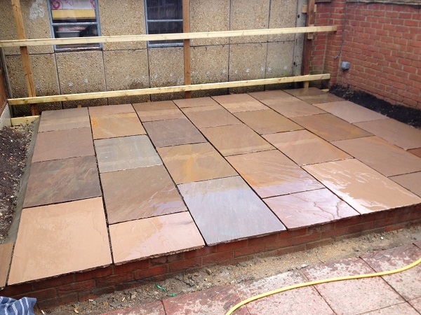 Raised Autumn Brown Indian sandstone patio ready for pointing
