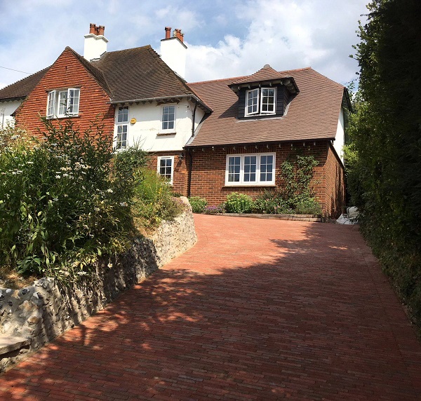 Steeply sloping driveway in Seville and Spalding clay pavers up to period house