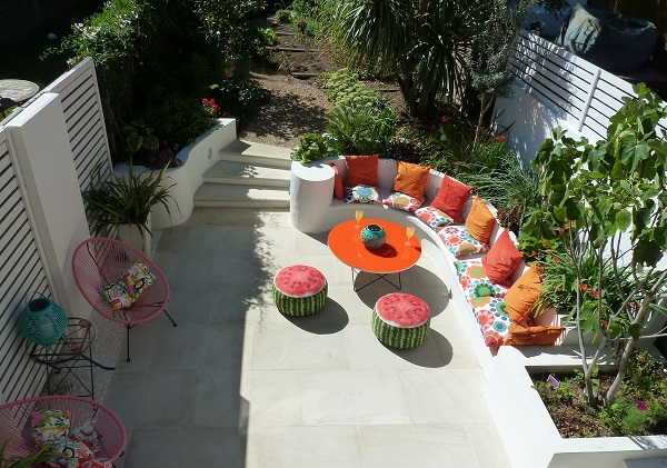Large curve-sided patio in Beige natural sandstone paving seen from above