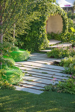 Bespoke Egyptian limestone plank paving surrounded by low planting in MacMillan Legacy Garden, RHS Hampton Court 2015