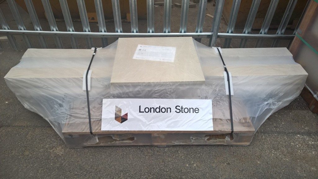 Wide cardboard package shrink-wrapped with London Stone label on front and top.