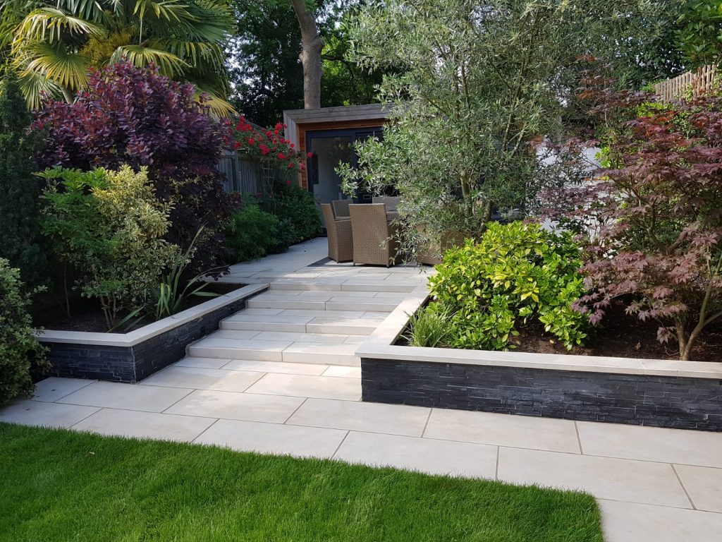 Lawn with path and steps in Slab Coke Italian outdoor tiles in porcelain. Design by John Gale Landscapes.