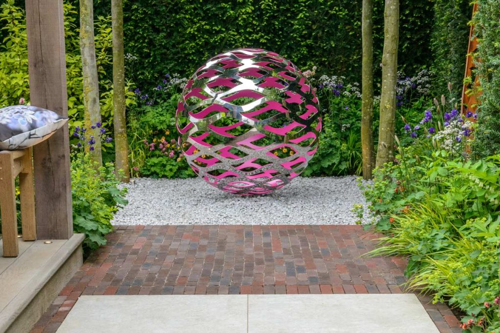 Abbey Dark Multi Clay Pavers with Silver Grey Porcelain and large metal sculpture on David Harber trade stand RHS Chelsea 2016